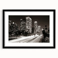 Extra large abstract art print of Los Angeles skyline in vibrant, colorful hues on a black framed canvas.