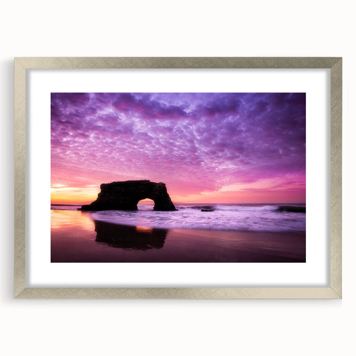 Textured abstract art print depicting the Santa Cruz coastline in muted blue and gray tones on a silver-framed canvas.