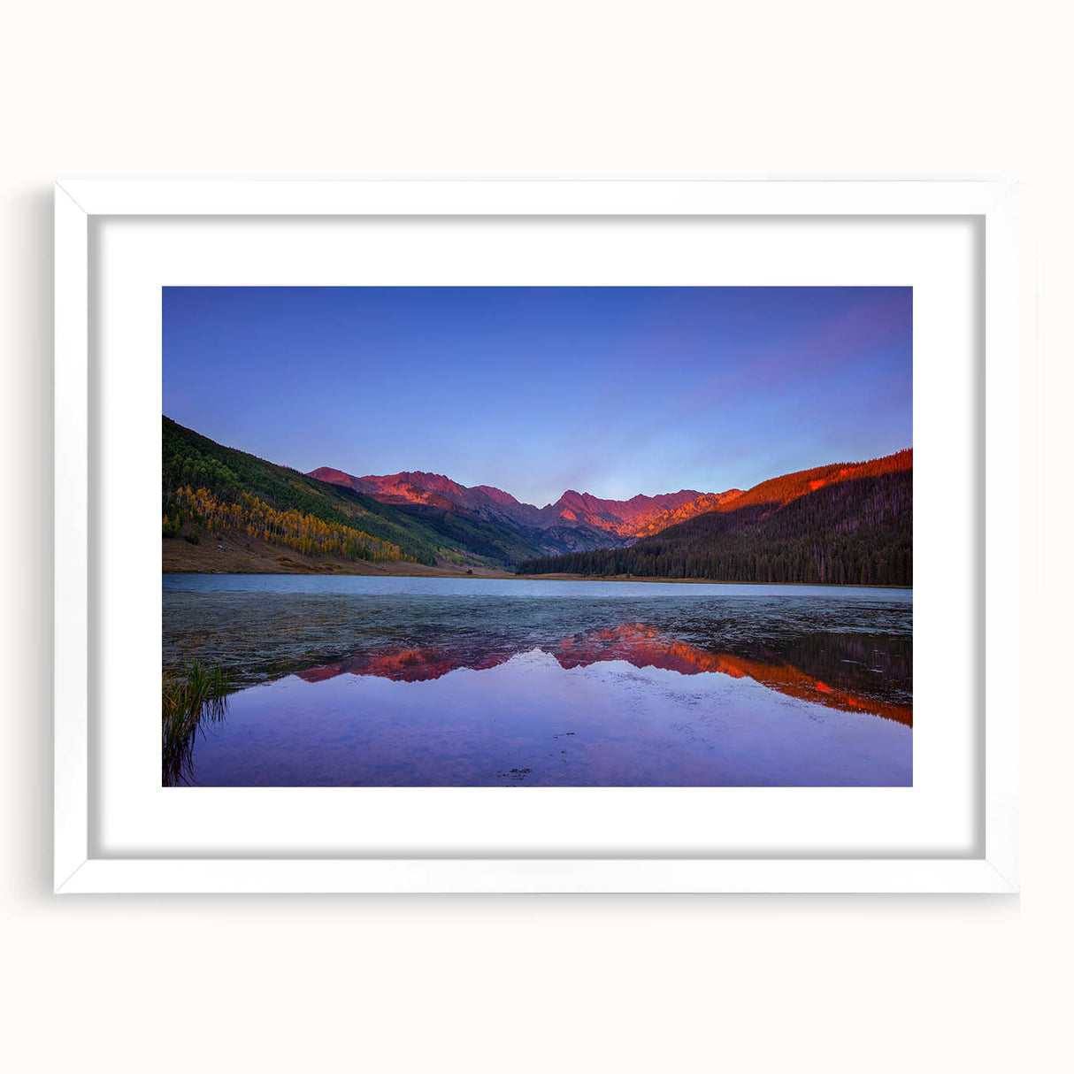Abstract art print of Vail, Colorado scenery in muted earth tones, framed with a white mat, suitable for dining room decor.