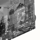 Large abstract wall art depicting the Denver skyline in muted blue and green tones on acrylic glass.