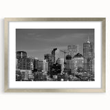 Textured abstract art print of Denver skyline in muted blue and gray, framed in silver, ideal for bedroom art.