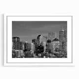 Abstract art print of Denver skyline in muted gray and blue tones on a white-framed canvas, ideal for dining room decor.