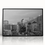 Large abstract wall art featuring a mid-century modernist depiction of the Denver skyline in muted earth tones on a framed…