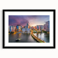Abstract art print of Miami skyline in vibrant colors on a large, textured canvas, framed in black.