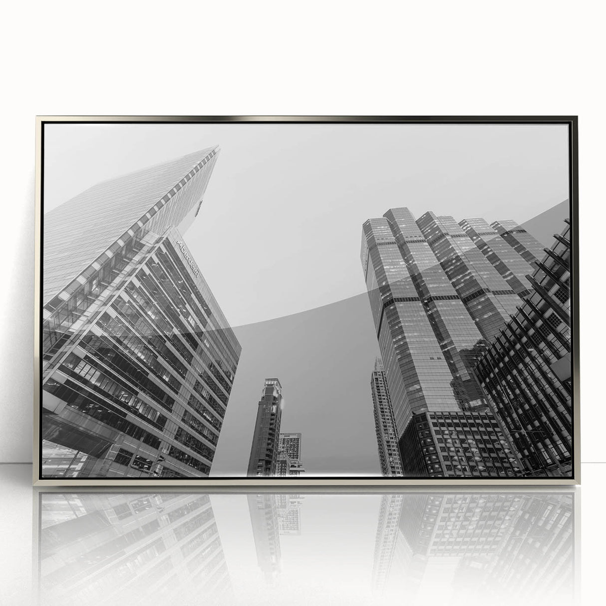 Mid-century modernist Atlanta skyline in muted gray and silver tones on a framed acrylic print.