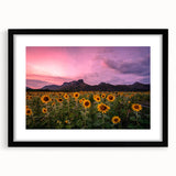 Colorful abstract art print depicting a textured Kansas landscape, in a black frame with mat.