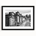 Abstract art print featuring vibrant, colorful depiction of New Orleans, framed in black, ideal for living room decor.