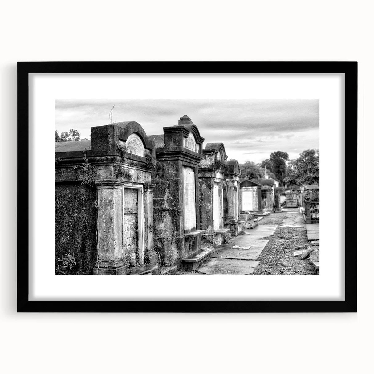 Abstract art print featuring vibrant, colorful depiction of New Orleans, framed in black, ideal for living room decor.