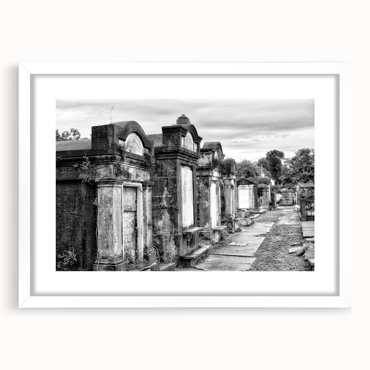 Abstract art print of New Orleans cityscape in muted gray and blue tones, framed with a white mat.