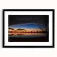 Abstract art print featuring vibrant, colorful textures, framed in black, ideal for living room decor.
