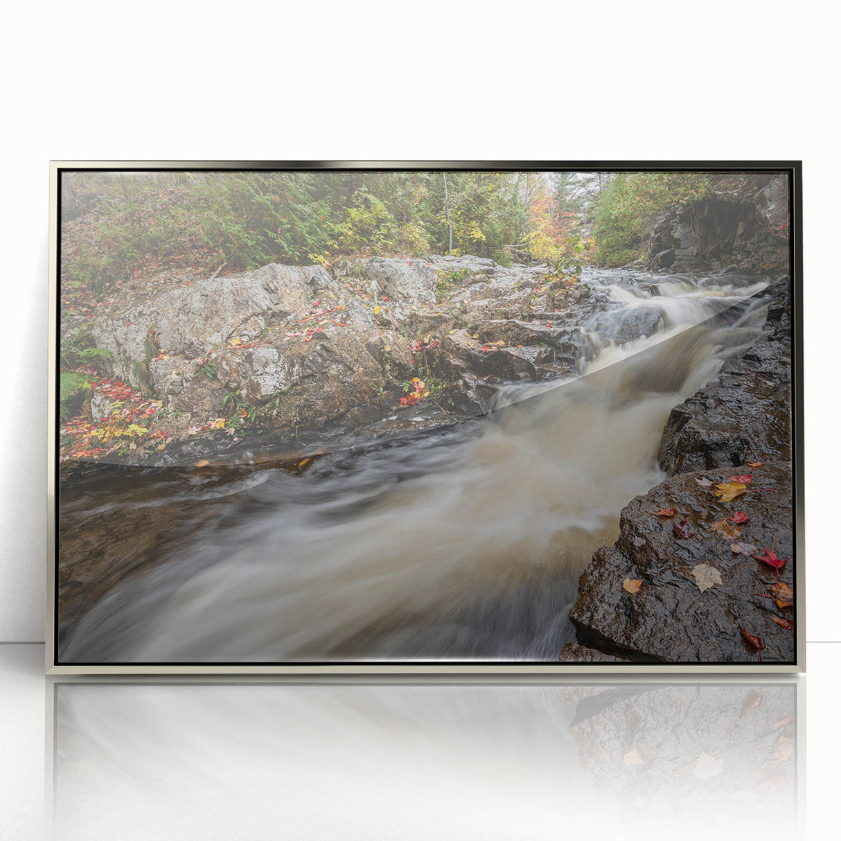 Mid-century modernist art depicting Acadia, Maine scenery in muted earth tones on a silver-framed acrylic print.