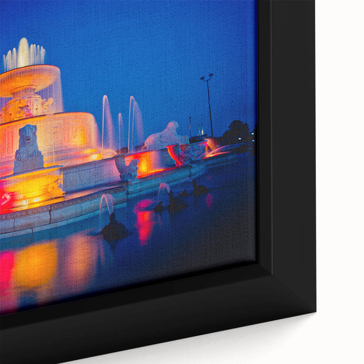 Close-up of a textured black wall art featuring a vibrant, colorful Detroit skyline on a framed canvas.