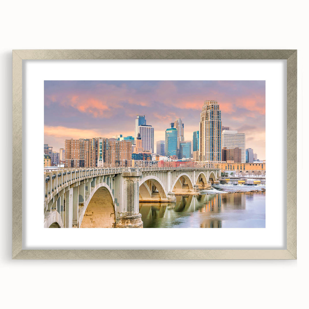 Textured art depicting abstract Minneapolis skyline in muted gray and blue tones on a framed silver mat.