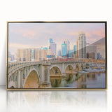 Framed acrylic print of Minneapolis skyline in mid-century modernist style, using gold and blue tones.