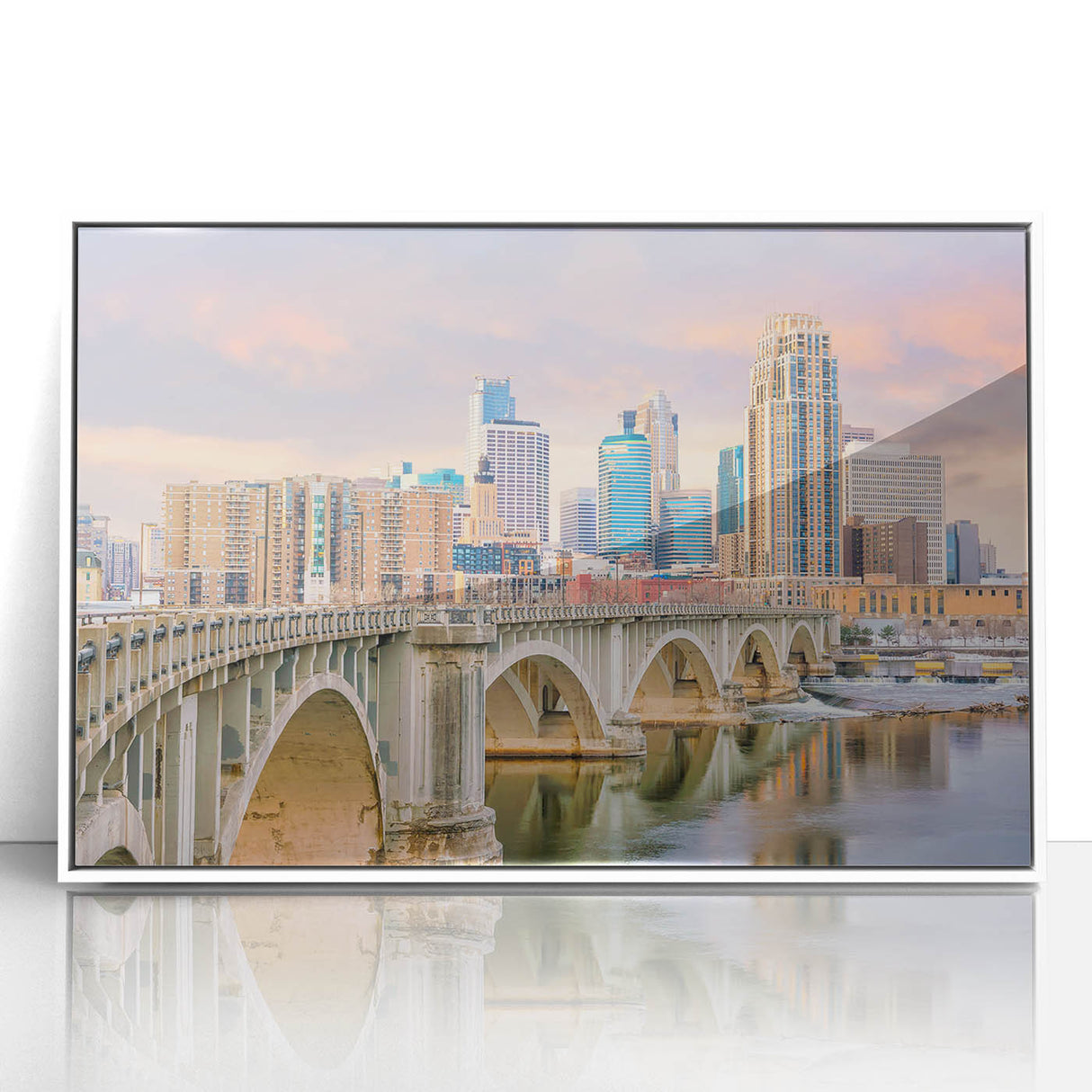 Acrylic print of Minneapolis skyline in muted gray and blue tones, framed in white, suitable for modern nursery decor.