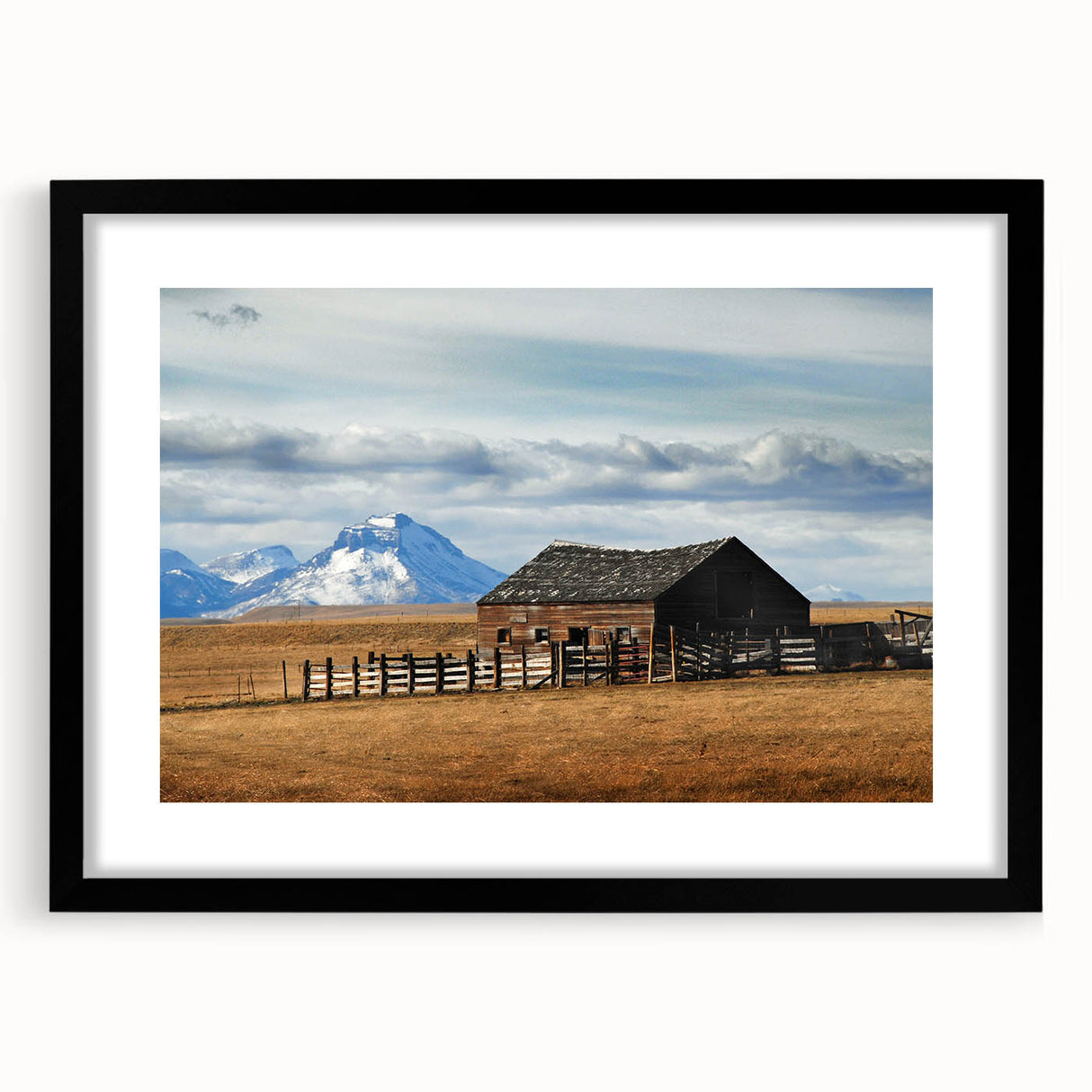 Extra large abstract art print of Montana scenery, featuring textured, colorful art in vibrant hues on a framed black mat.