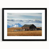 Extra large abstract art print of Montana scenery, featuring textured, colorful art in vibrant hues on a framed black mat.