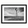 Abstract art print of textured, colorful Nebraska scenery on a large canvas, framed in black, ideal for living room decor.