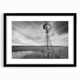 Abstract art print of textured, colorful Nebraska scenery on a large canvas, framed in black, ideal for living room decor.