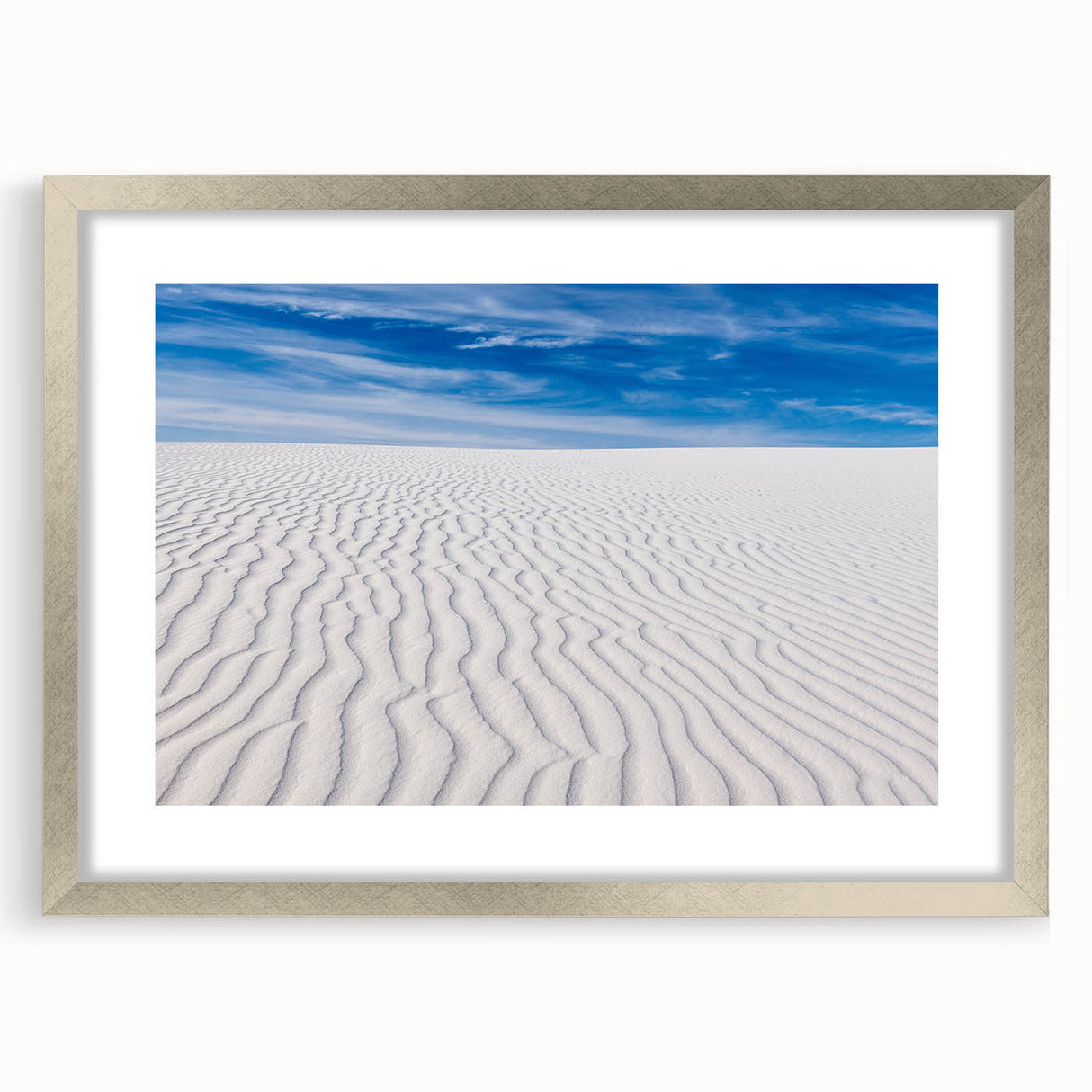 Textured art of abstract white sands in New Mexico with a silver frame, ideal for bedroom decor.