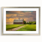 Textured art depicting abstract North Dakota scenery in muted earth tones on a framed silver mat, suitable for bedroom decor.