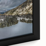Close-up of a black framed canvas depicting the Adirondack scenery, featuring colorful, textured art.