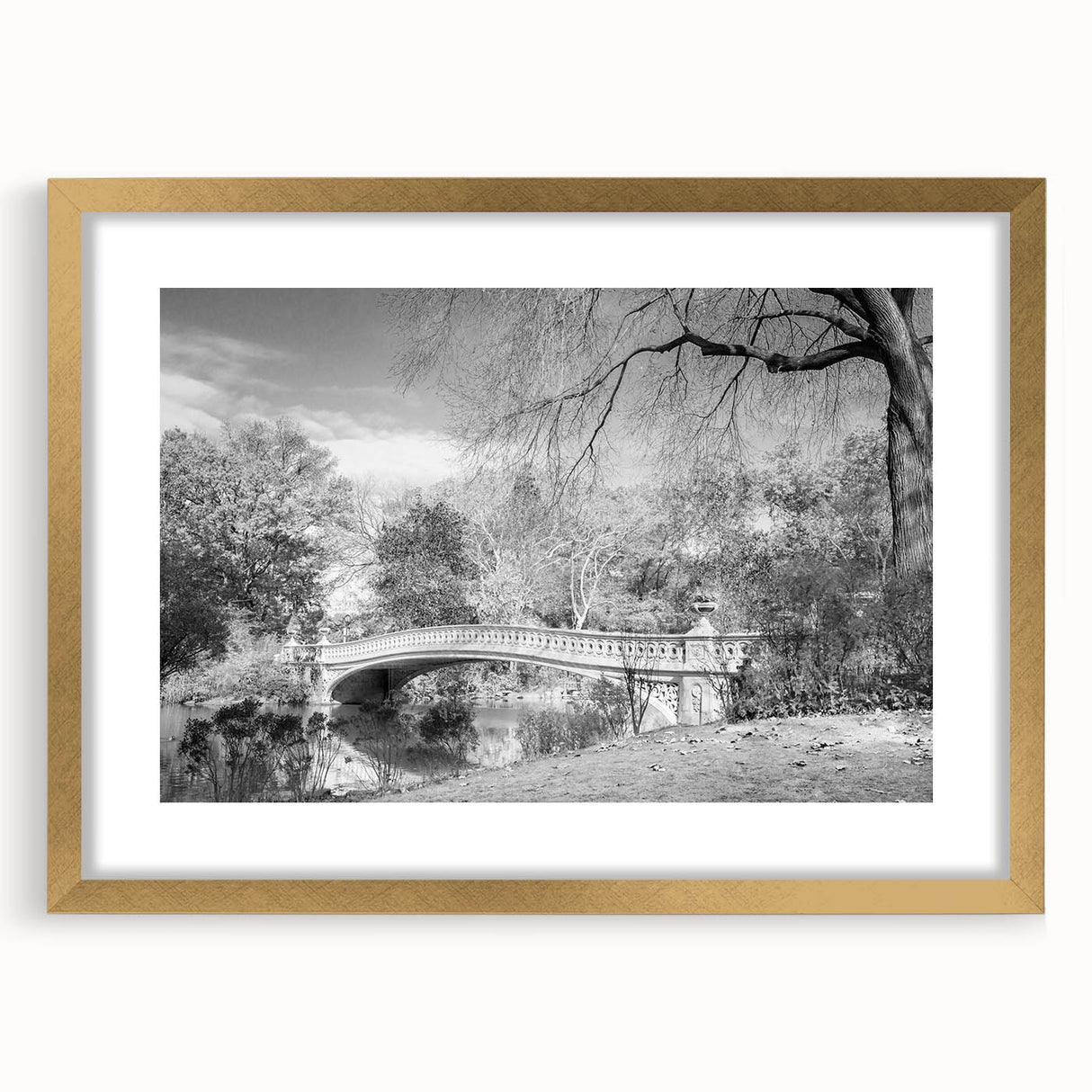 Extra large framed wall art depicting an abstract Central Park scene in textured gold and green tones.