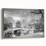 Framed canvas of a vintage-style Central Park landscape painting in muted green and brown tones, ideal for living room decor.