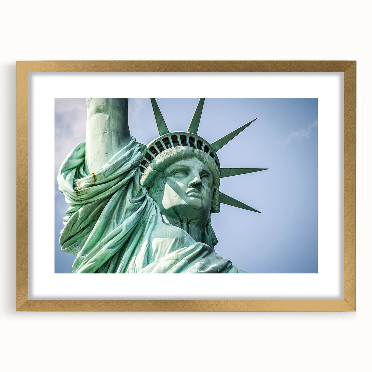 Extra large abstract art print of the NYC skyline and Statue of Liberty in muted gray tones, framed in gold.