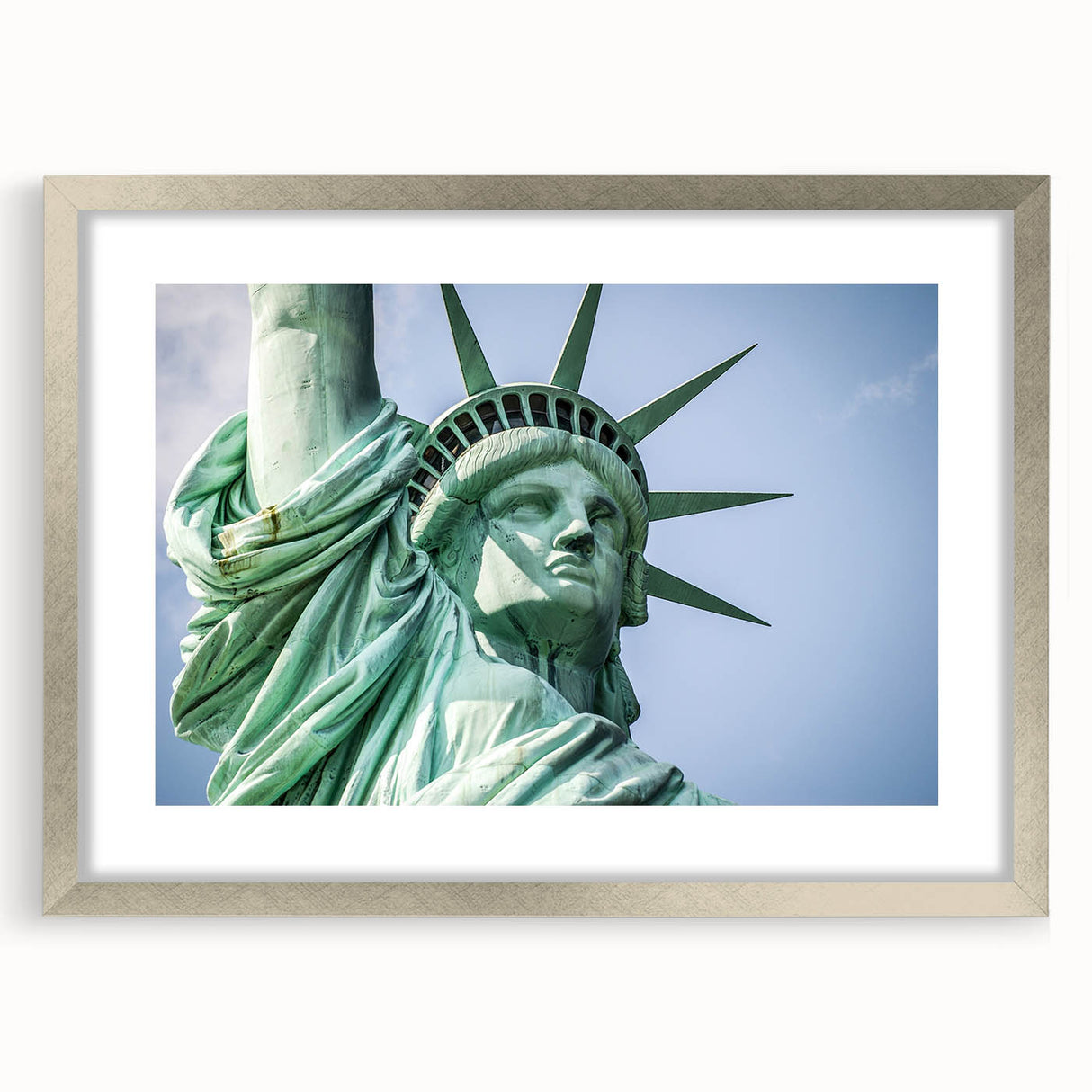 Textured art print of the Statue of Liberty in abstract style, featuring muted green and blue tones on a framed silver mat.
