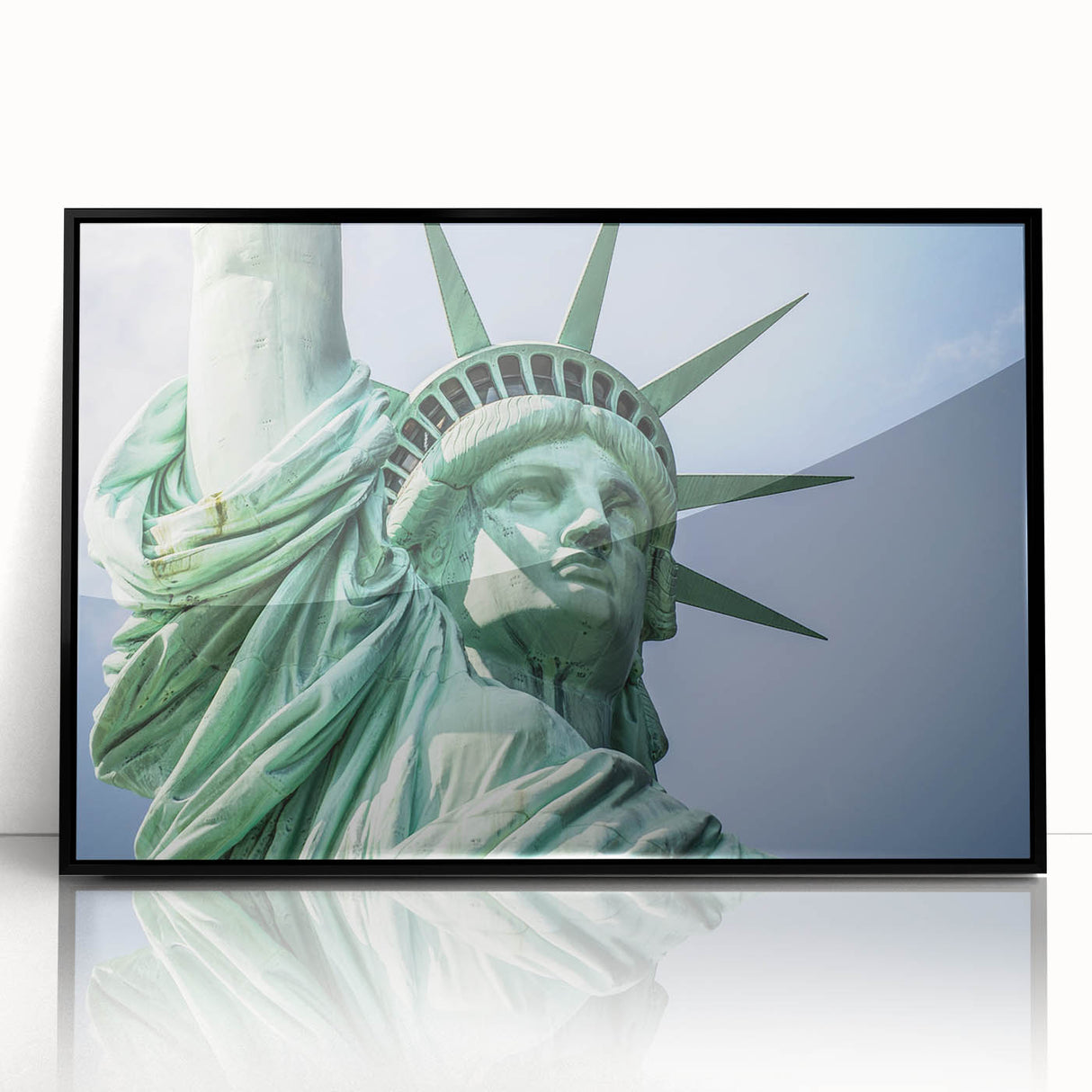 Large abstract wall art of the NYC skyline featuring the Statue of Liberty, in black and white tones on framed acrylic.