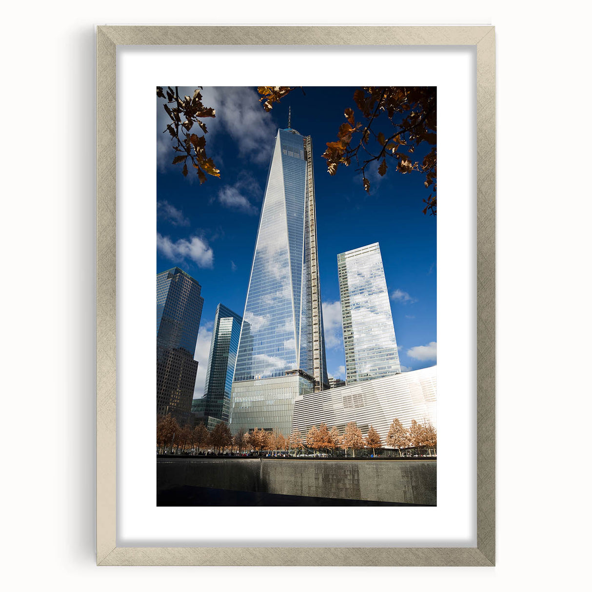Textured art print of NYC Trade Center in muted gray tones on a framed silver mat, suitable for bedroom art.