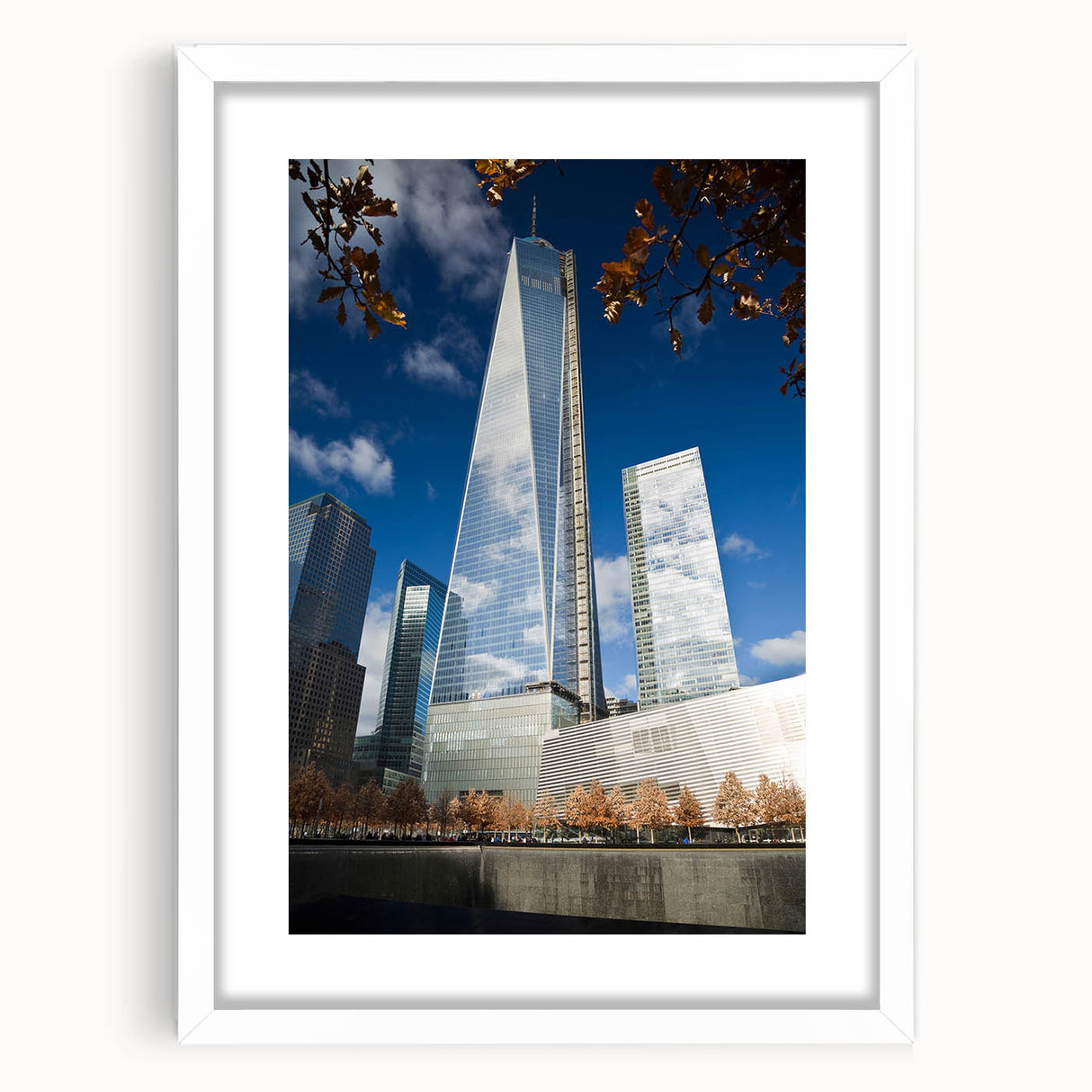 Abstract art print of NYC skyline in muted gray and blue tones, framed with white mat, ideal for dining room decor.