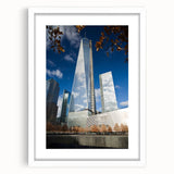 Abstract art print of NYC skyline in muted gray and blue tones, framed with white mat, ideal for dining room decor.