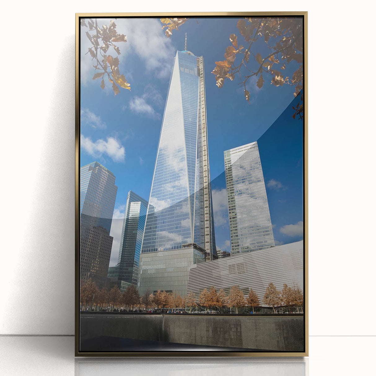 Acrylic print of NYC skyline with Twin Towers, in gold and black tones, styled in mid-century modernist art.