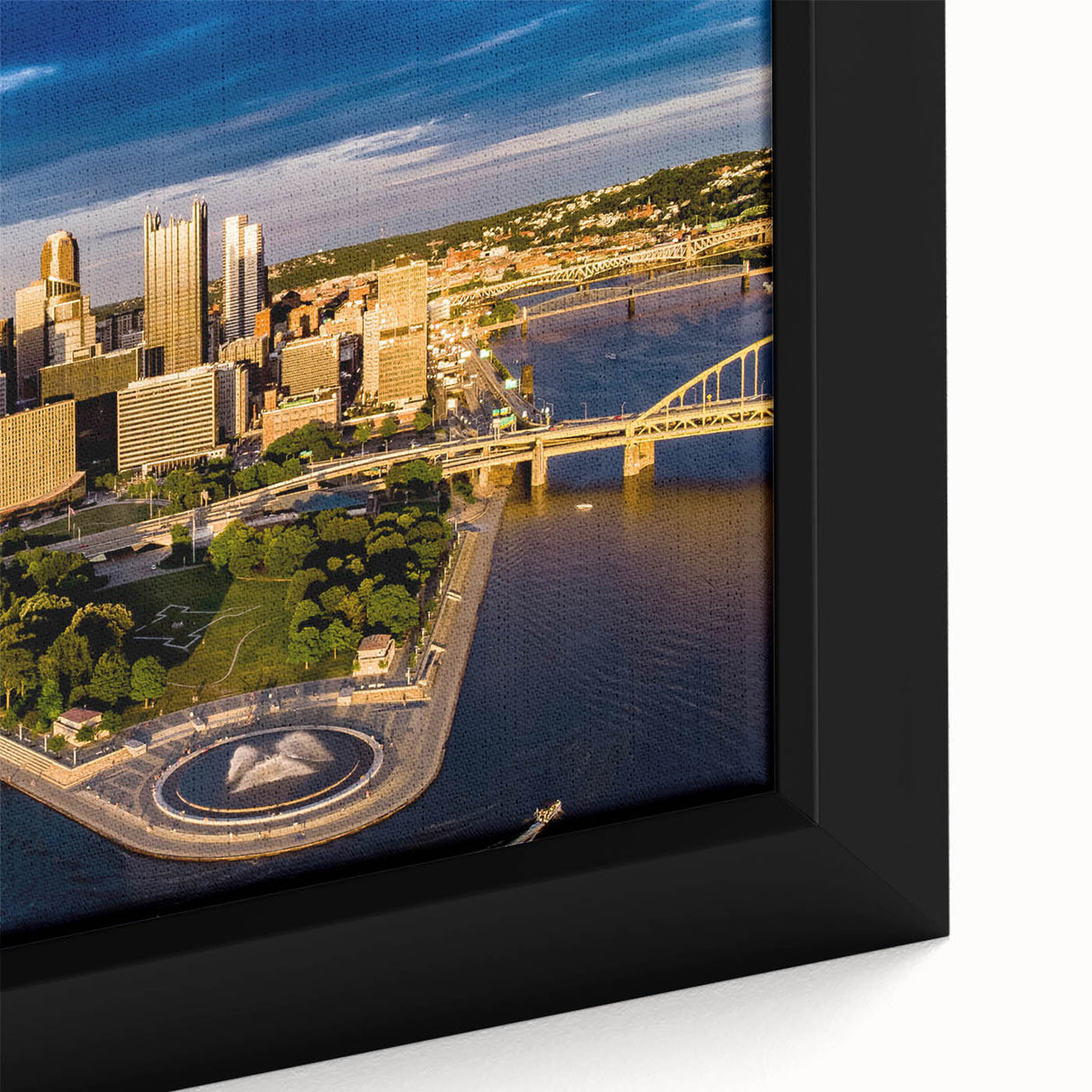 Black wall art featuring a textured depiction of Pittsburgh's skyline in colorful hues on a framed canvas.