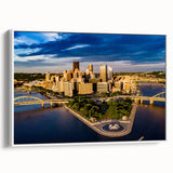 Vintage poster art of Pittsburgh skyline in vibrant colors on a large framed canvas, ideal for living room decor.