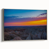 Landscape art painting of South Dakota Badlands on silver-framed canvas, featuring earthy red and brown tones.