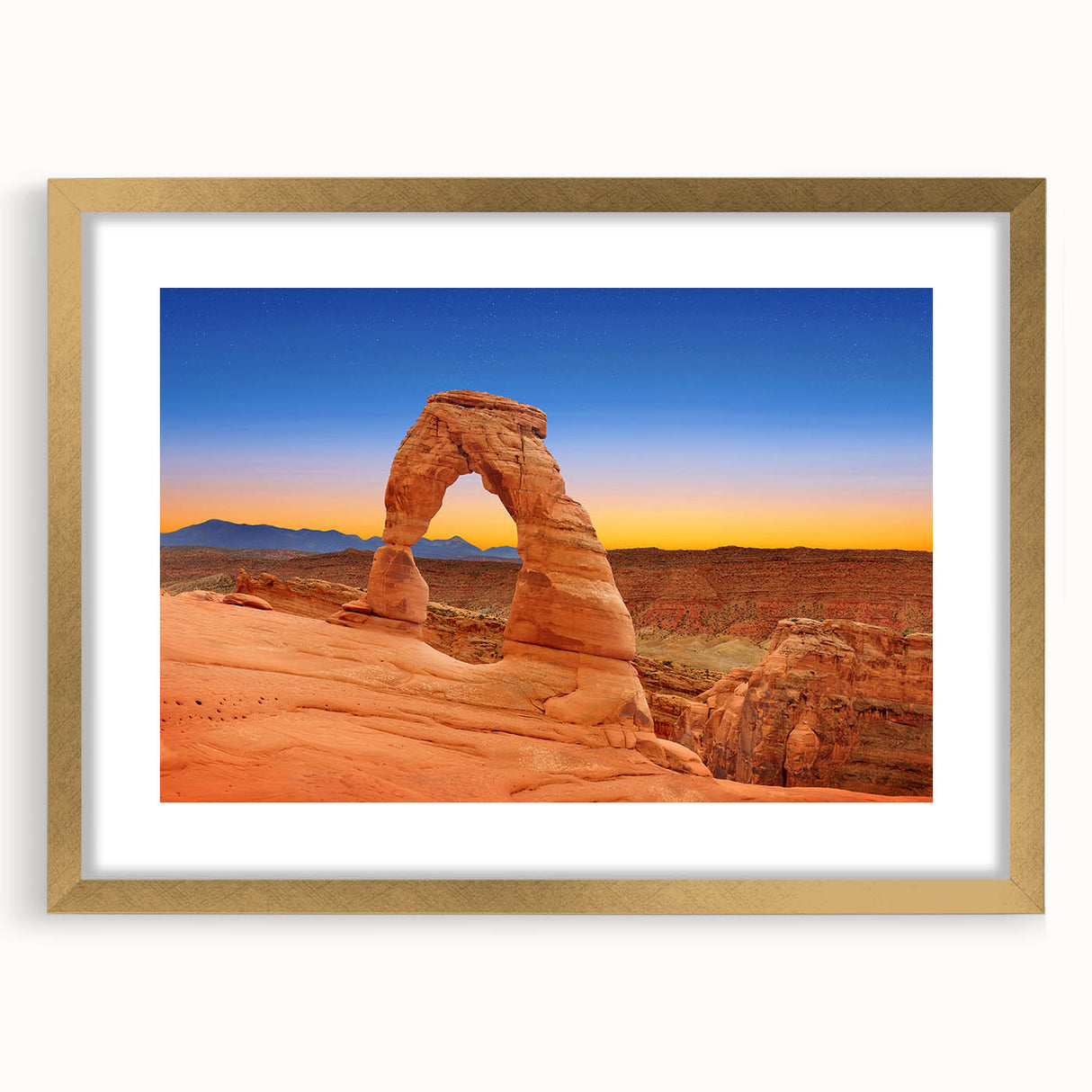 Extra large abstract art print depicting Arches National Park in textured gold frame, ideal for living room decor.