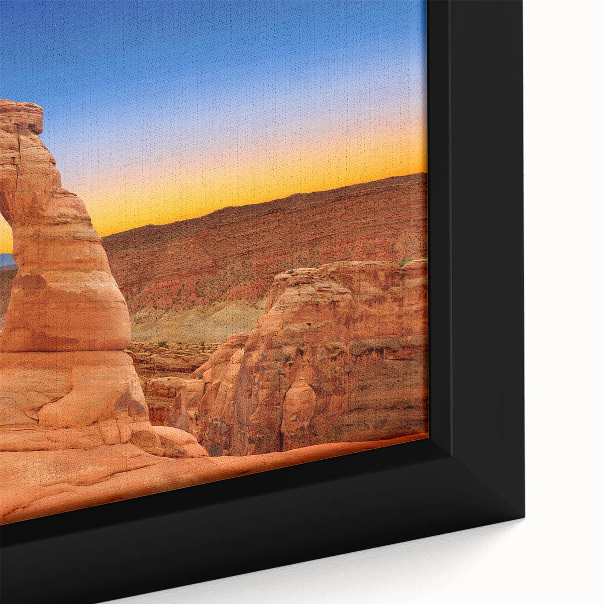 Textured black wall art depicting Arches National Park in vibrant colors on a framed canvas, ideal for living room decor.