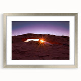 Textured art of Canyonlands with abstract design in earthy tones on a silver-framed mat, ideal for bedroom decor.
