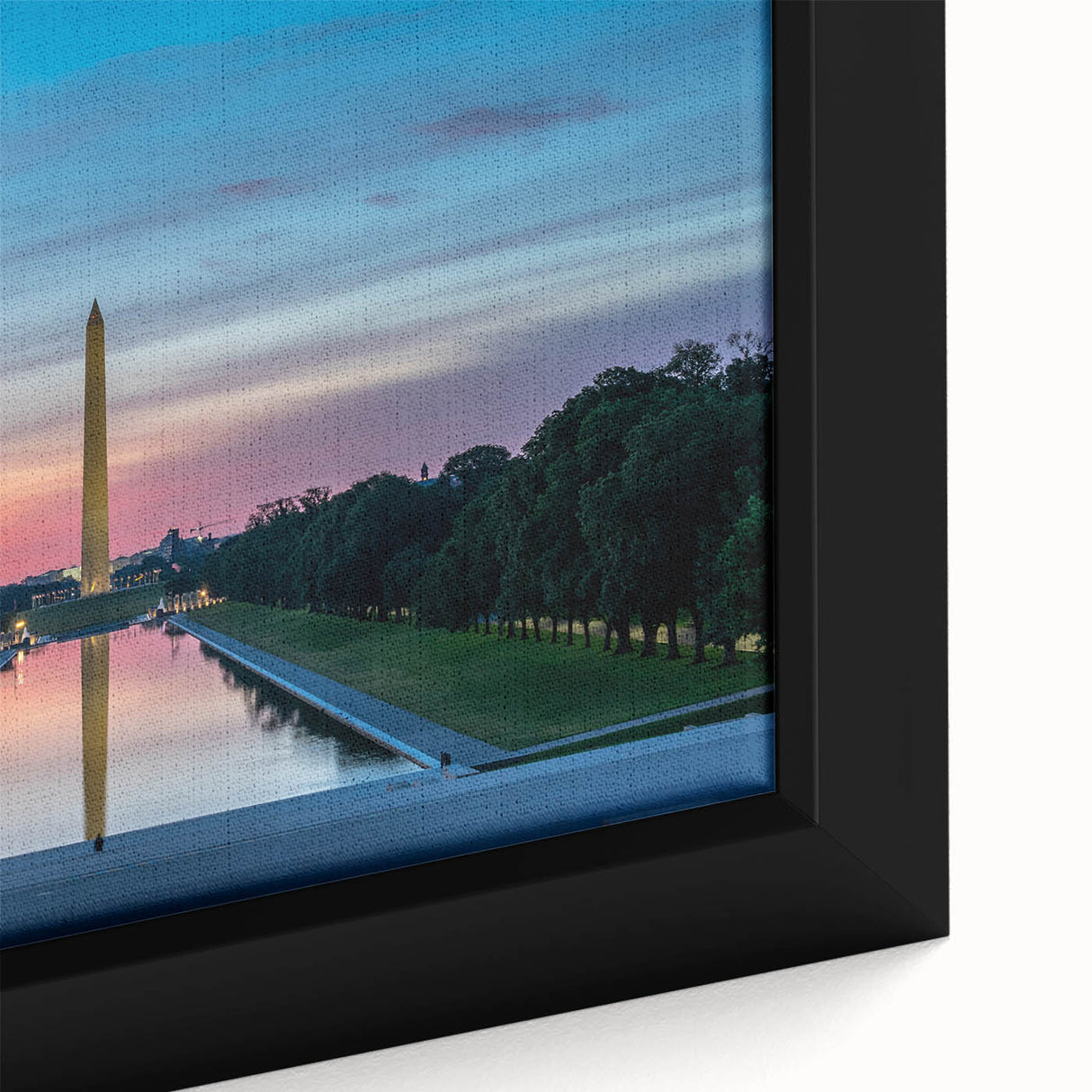 Close-up of a textured, black wall art featuring the Washington DC monument in vibrant colors on a framed canvas.