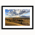 Colorful abstract art print of Wyoming's Grand Tetons in a black frame, ideal for living room decor.