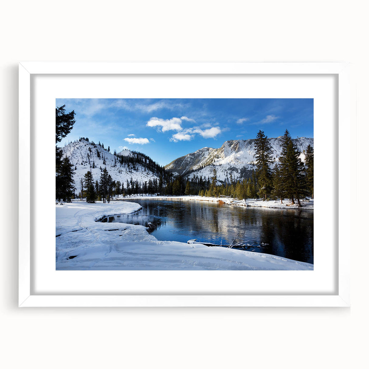 Abstract art print depicting Yellowstone scenery in muted earth tones on a framed white mat, suitable for dining room decor.