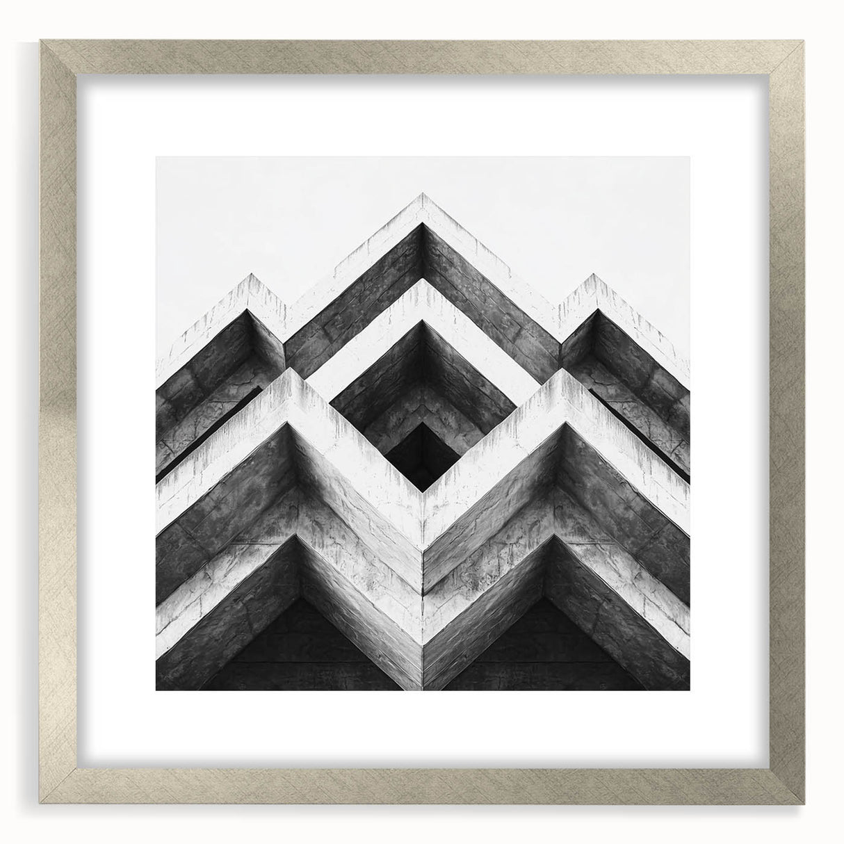 Textured abstract art print in silver frame, featuring undulating gray patterns, ideal for modern bedroom decor.