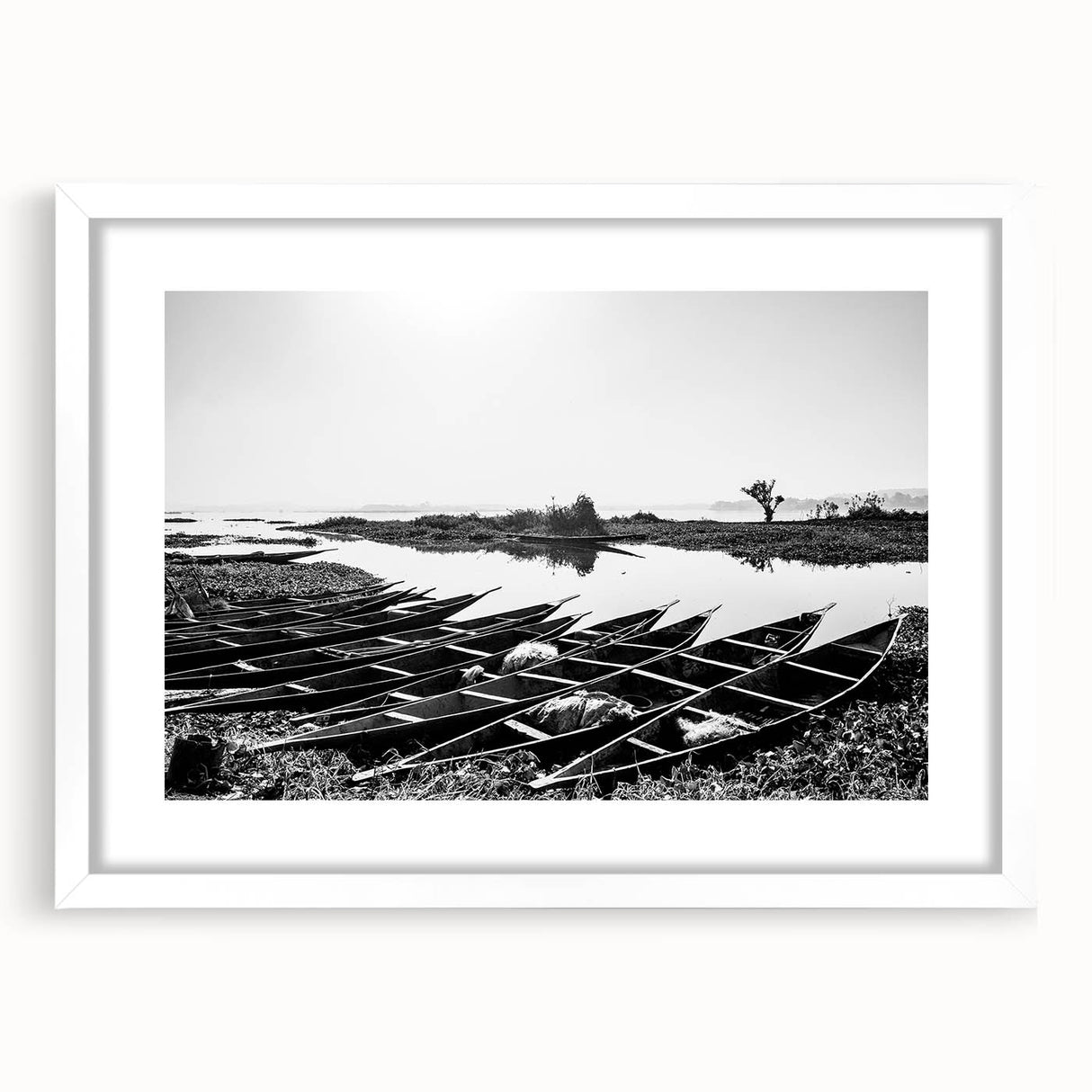 Extra large abstract art print featuring textured scenery of Mali in muted earth tones, framed in white.