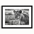 Extra large colorful art print depicting an abstract African scenery in vibrant hues on textured canvas, framed in black.