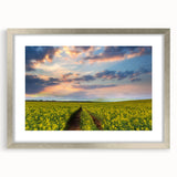 Textured art print of an abstract landscape in muted earth tones, framed in silver, ideal for bedroom decor.