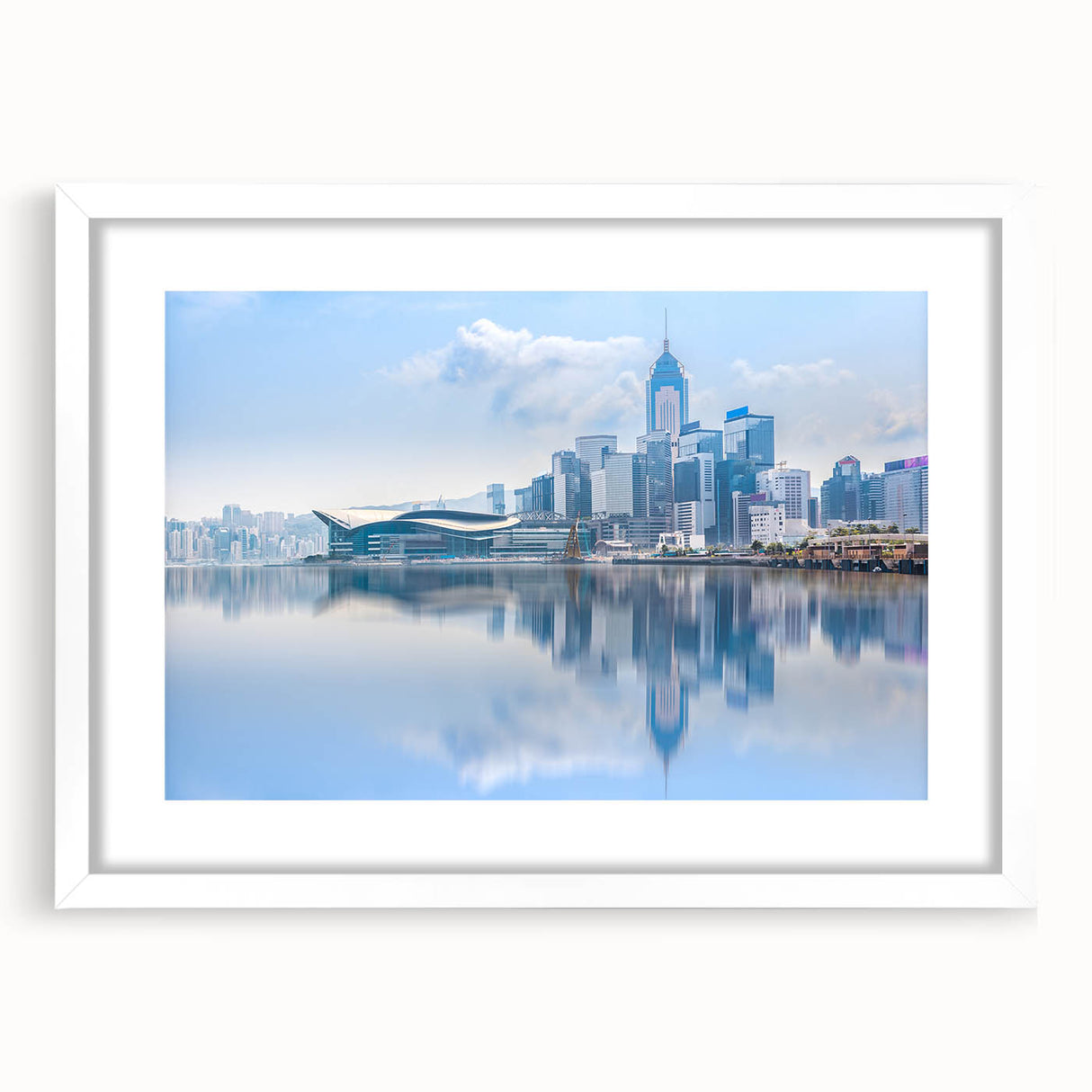 Abstract art print of Hong Kong skyline in muted gray and blue tones on a framed white canvas.