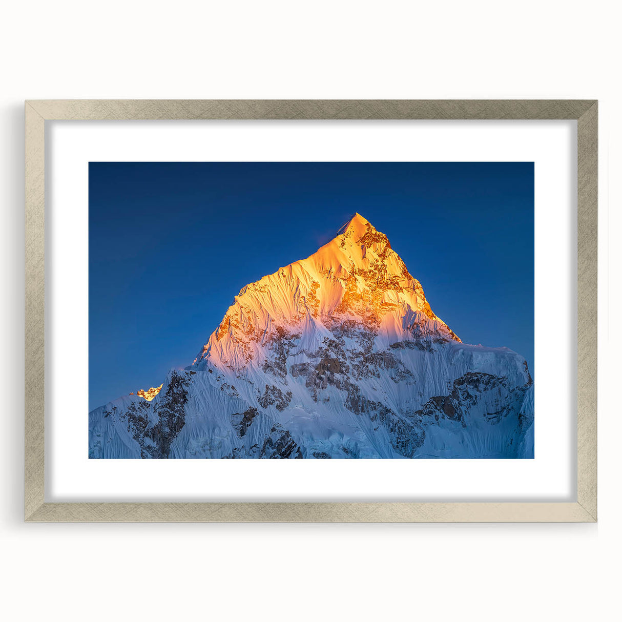 Textured art print of Mount Everest in abstract style, with cool blue and white tones, framed in silver.